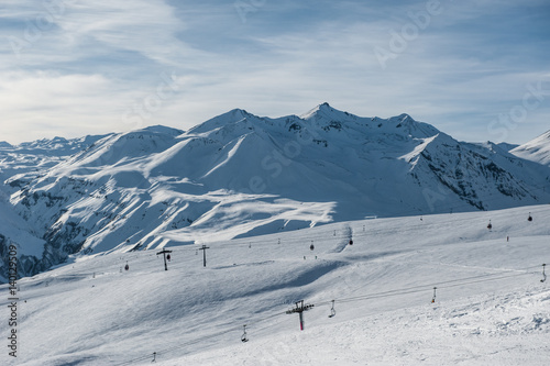 Snowy winter mountains in sun day. Caucasus Mountains, Georgia, from ski resort Gudauri © irimeiff
