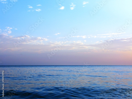 Blue sea ocean horizon sky clouds photo