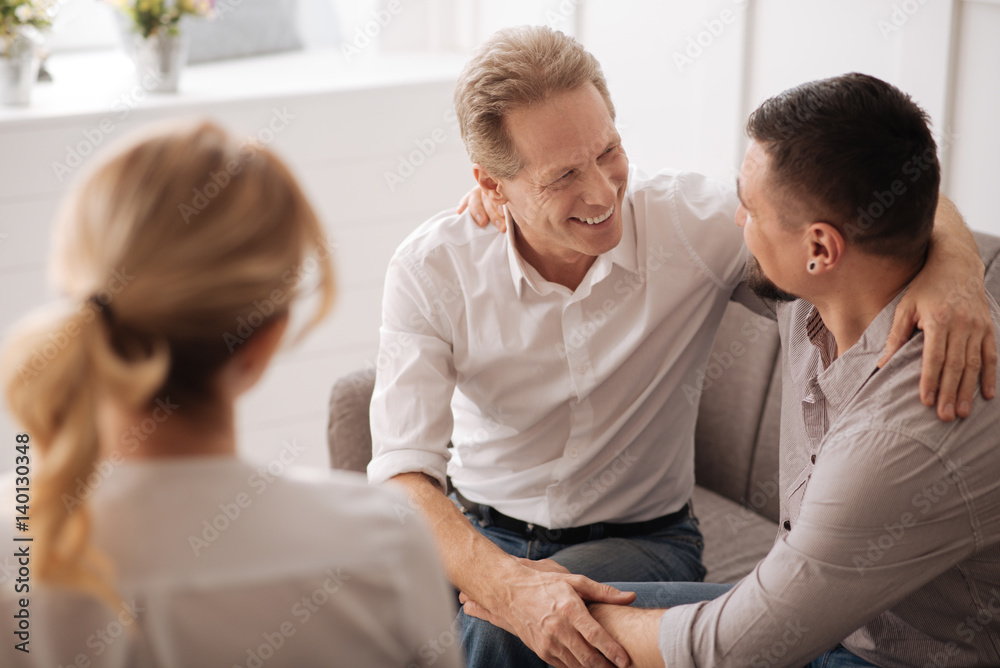 Delighted positive man looking at his boyfriend Delighted positive man looking at his boyfriend