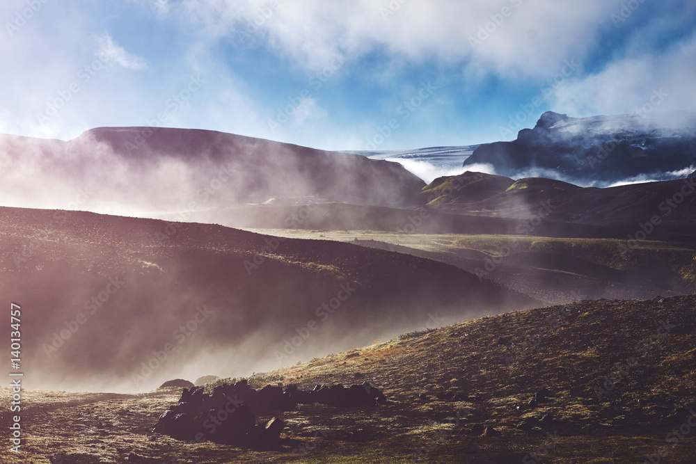 Travel to Iceland. Beautiful Icelandic landscape with mountains, sky and clouds. Trekking in national park Landmannalaugar. foggy morning in Camping . Travel concept.