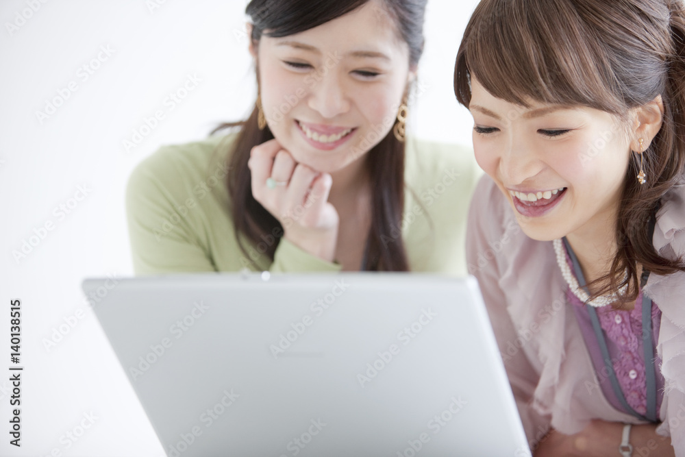 Smiling businesswomen working together in the office Smiling businesswomen working together in the office