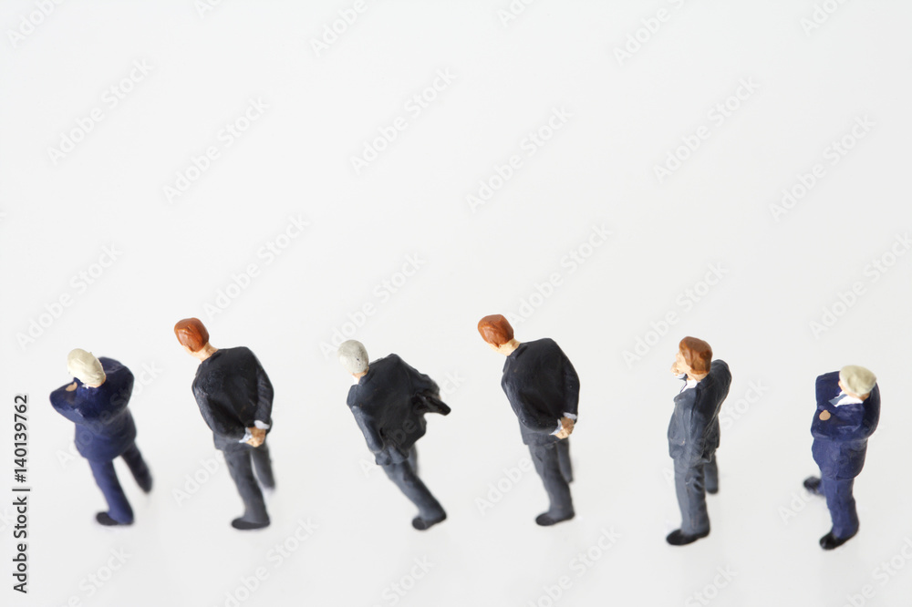 Businessmen figurines standing in a row