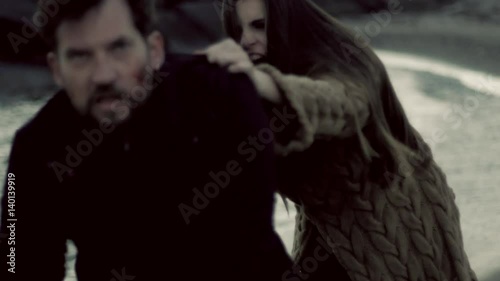 Man running away from angry female vampire slow motion green color correction