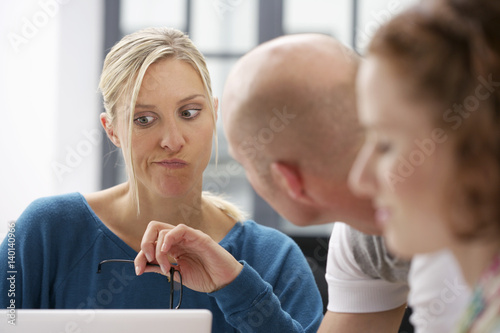 Three businesspeople having a meeting