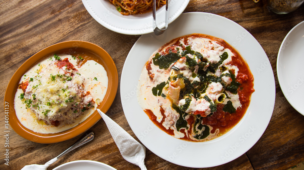 tomato cream pesto pasta with mozzarella cheese below tomato cream pesto pasta with mozzarella cheese below