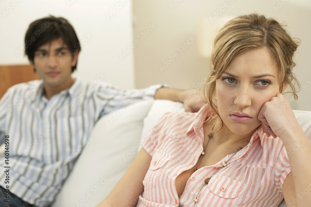 Dissatisfied man sitting in background Dissatisfied man sitting in background