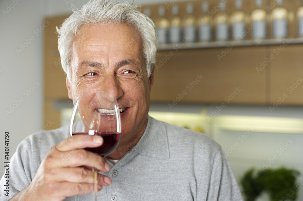 Gray-haired man with a glass of wine in his hand, close-up Gray-haired man with a glass of wine in his hand, close-up