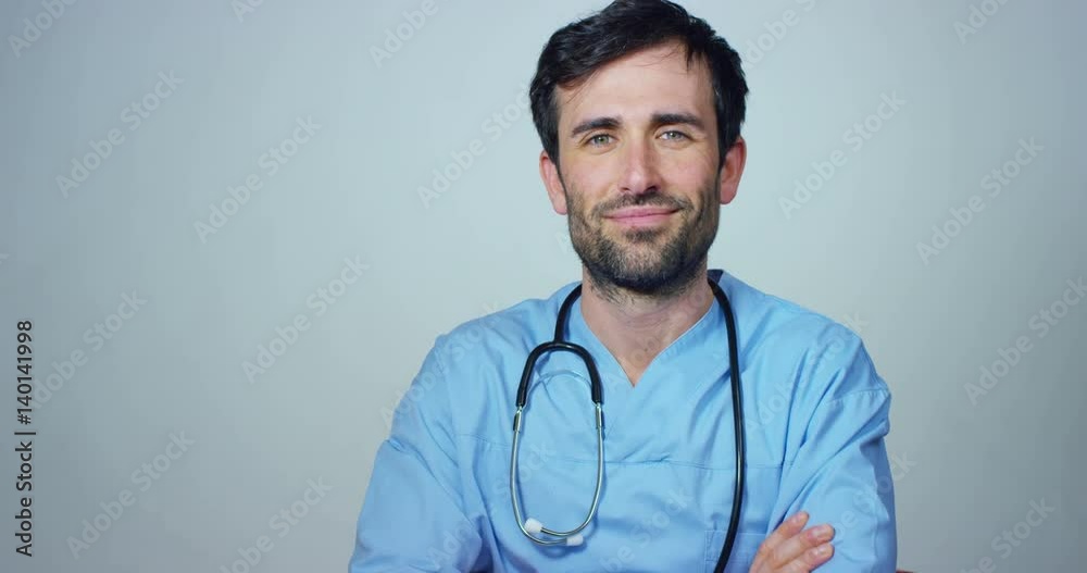 close up portrait of a surgeon or doctor with mask and headset ready for operation in hospital or clinic. The surgeon smiles safe and proud of himself. Concept of medicine, hospitals and doctors, care close up portrait of a surgeon or doctor with mask and headset ready for operation in hospital or clinic. The surgeon smiles safe and proud of himself. Concept of medicine, hospitals and doctors, care