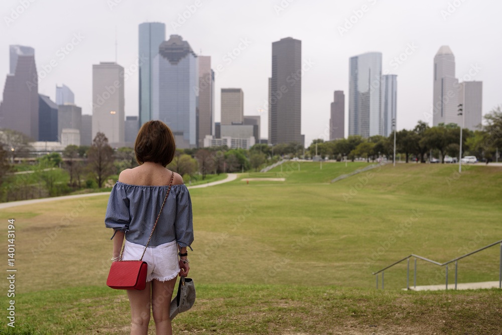 A visitor enjoys a view of downtown Houston in TX USA