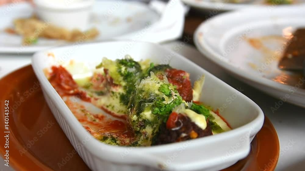 homemade meatballs baked with tomato, cream and pesto sauce homemade meatballs baked with tomato, cream and pesto sauce
