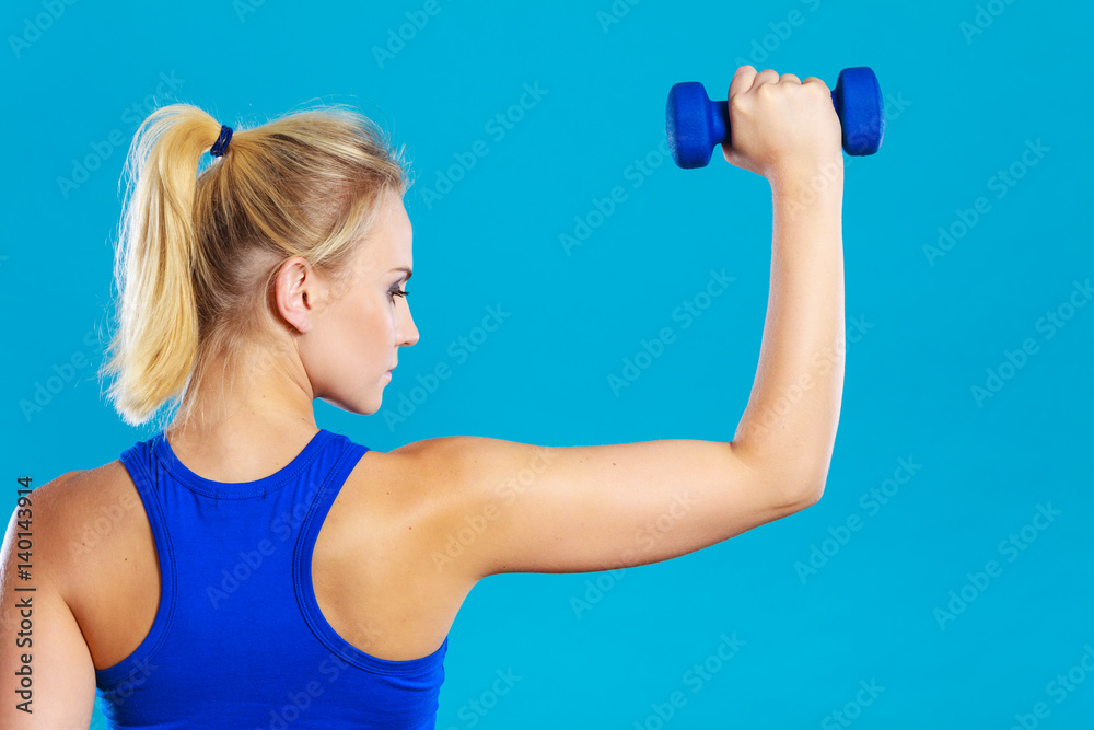 Fit woman lifting dumbbells weights Fit woman lifting dumbbells weights