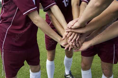 Kickers putting hands together