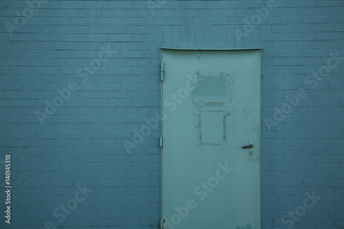 Door in a blue wall