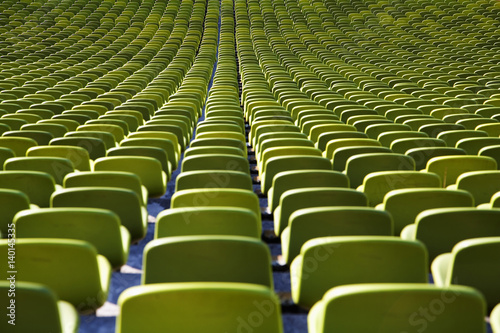 Seats in a row inside an empty stadium