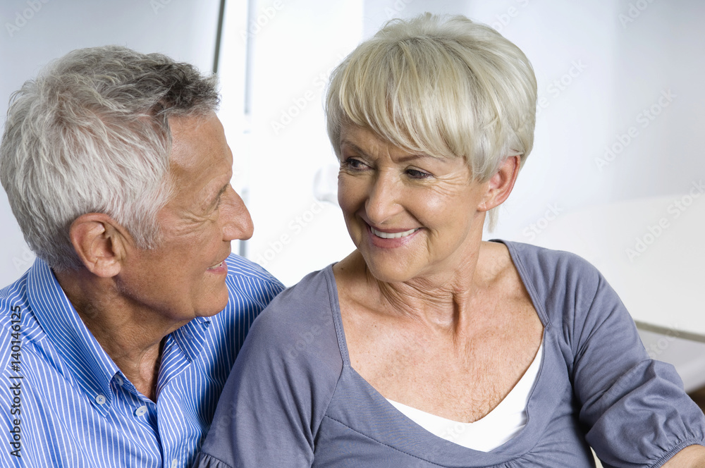Senior couple smiling each other Senior couple smiling each other