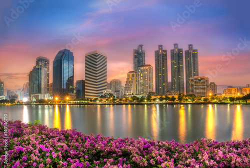 Bangkok city downtown at sunrise with reflection of skyline, Bangkok,Thailand © tope007