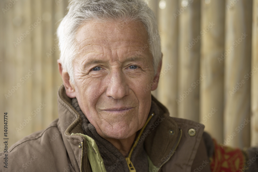 Senior adult man wearing an anorak, close-up Senior adult man wearing an anorak, close-up