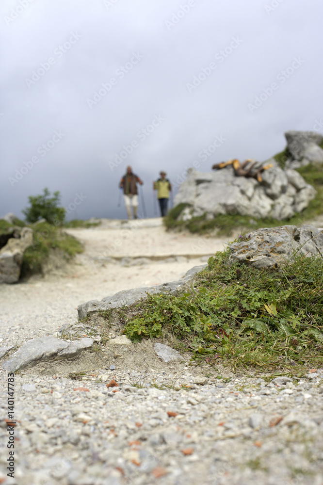 Heterosexual Couple hiking in the mountains, low angle view