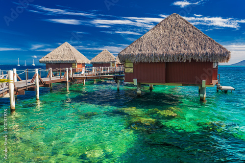 Overwater bungalows with best beach for snorkeling, Tahiti, Polynesia