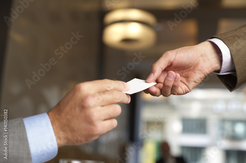 Businessman handing over a business card
