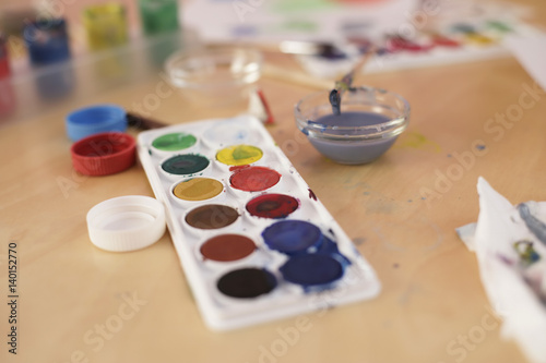 Color palette and painting implements on a table