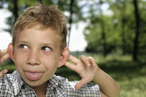 Boy making a grimace at camera