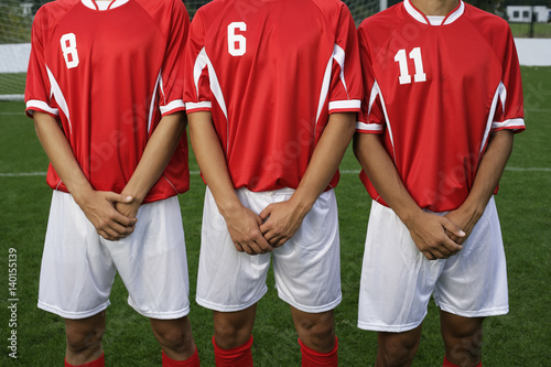 Soccer players forming a wall