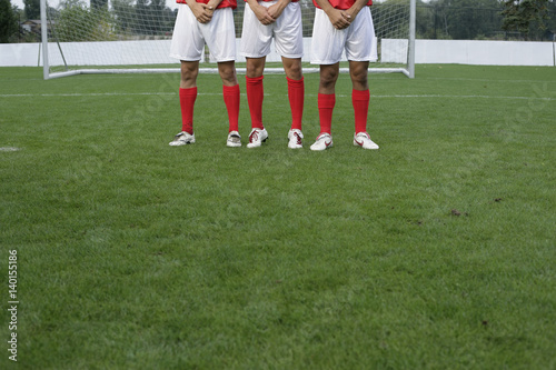 Soccer players forming a wall
