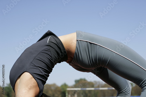 Woman doing backbend photo