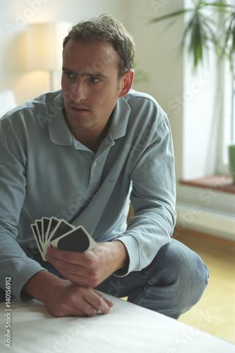 Man holding Playing Cards