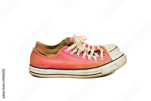 Side angle view of The old red sneakers with clipping path, isolated on a white background
