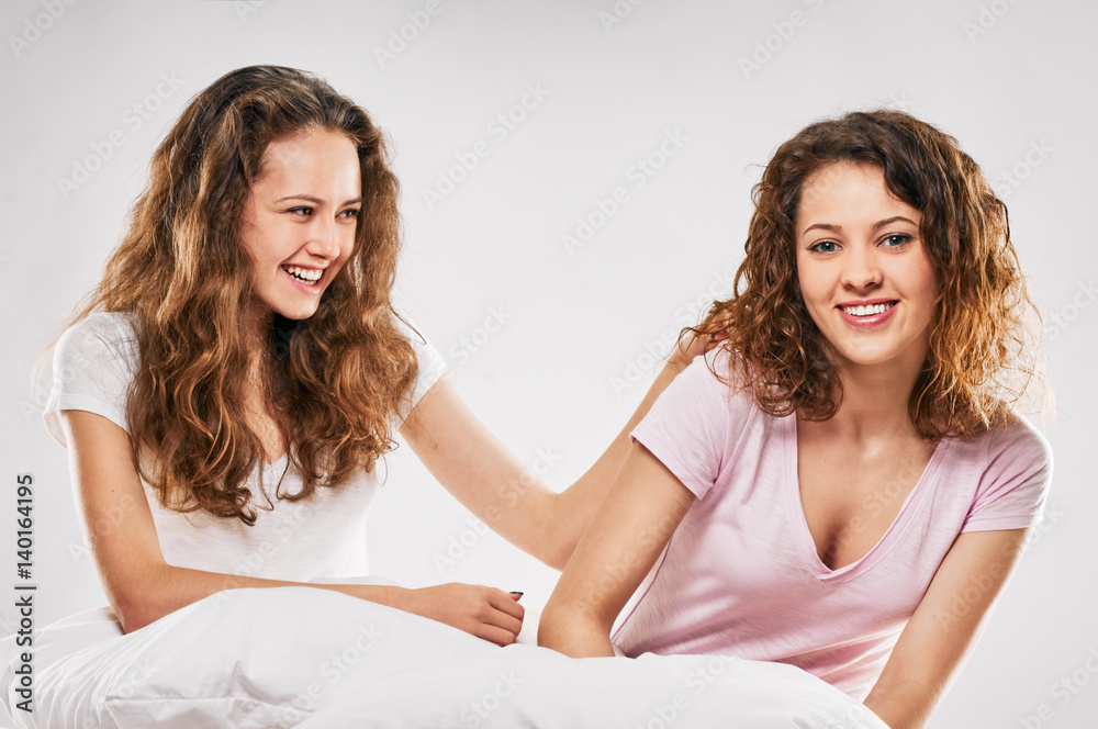 Happy sisters in bed Happy sisters in bed