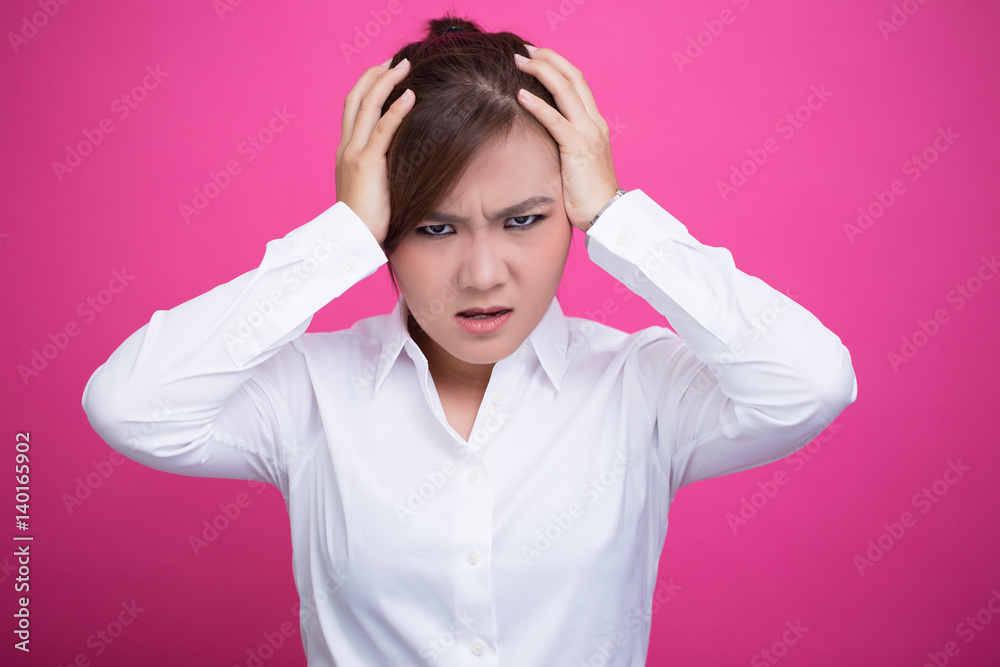 Angry woman screaming out and pulling her hair Angry woman screaming out and pulling her hair