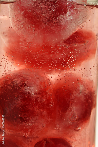 Cherry berries frozen in ice in water  3