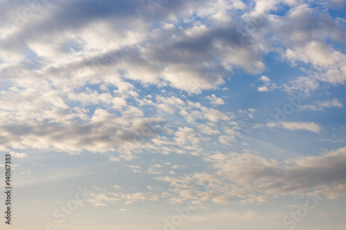 Cumulus white air clouds against blue sky