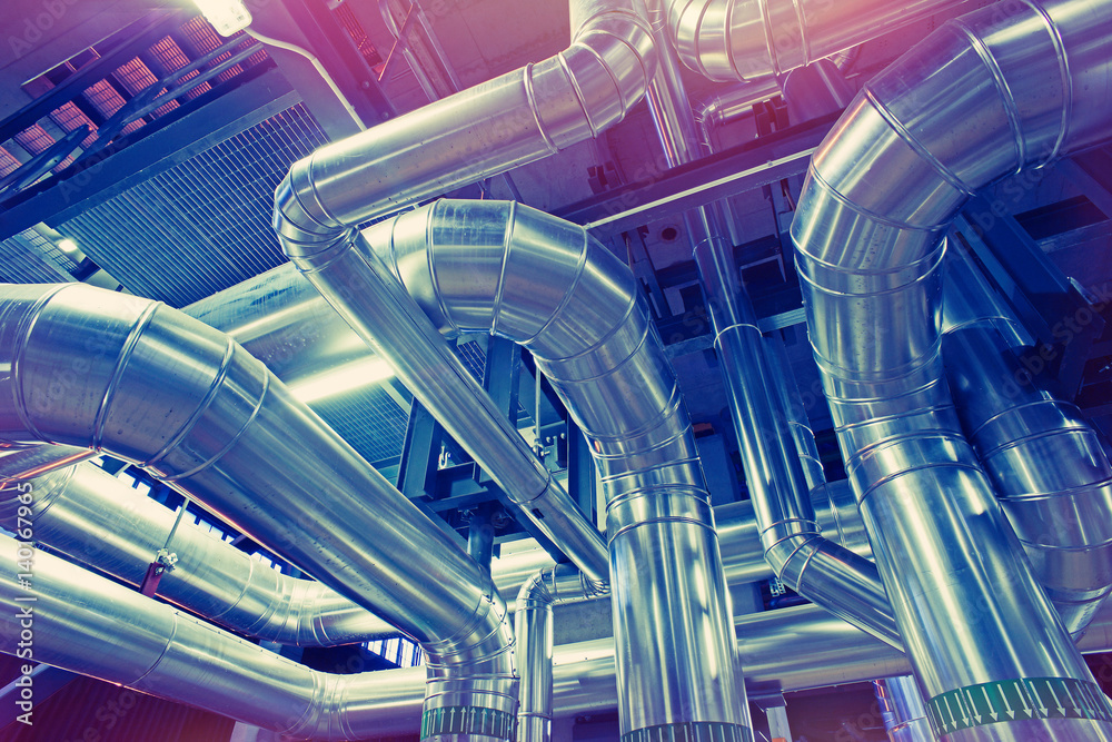 Equipment, cables and piping as found inside of a modern industrial power plant Equipment, cables and piping as found inside of a modern industrial power plant