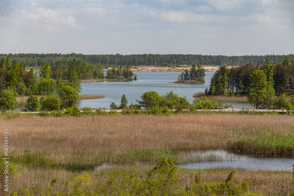 Abandoned sand quarry with lakes and forest Abandoned sand quarry with lakes and forest