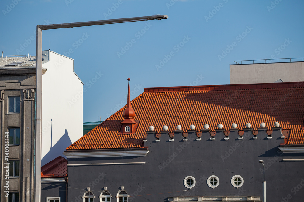 Modern building of theatre with red tile roof at sunny day. Tallinn, Estonia