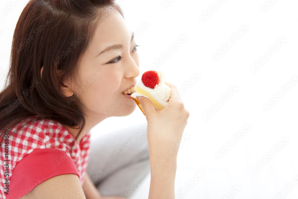 Young woman enjoying a slice of cake Young woman enjoying a slice of cake
