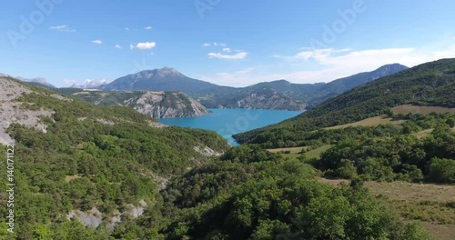 Aerial flying down to serre ponçon lake