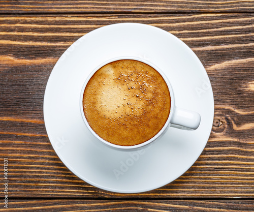 Fototapeta Naklejka Na Ścianę i Meble -  White cup of espresso on a wooden background