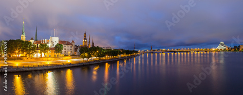 Panoramic view of Old Town of Riga  Latvia  in the evening. The view from bridge over Daugava river.