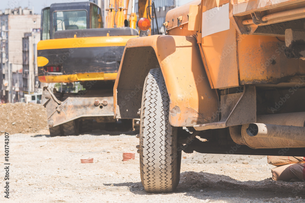 Truck on a construction site with sand, dirt and cement. Truck on a construction site with sand, dirt and cement.