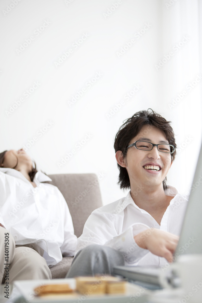 Young couple using laptop Young couple using laptop