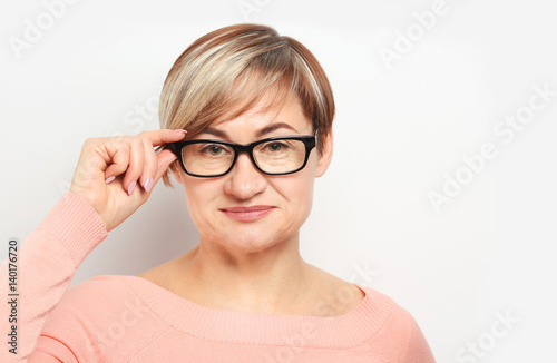 Mature woman wearing glasse...