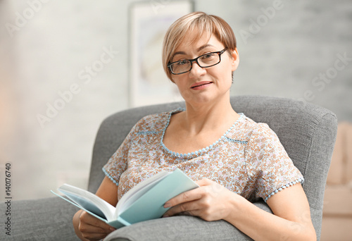 Mature woman wearing glasse...