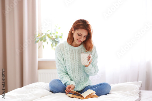 Young beautiful woman readi...