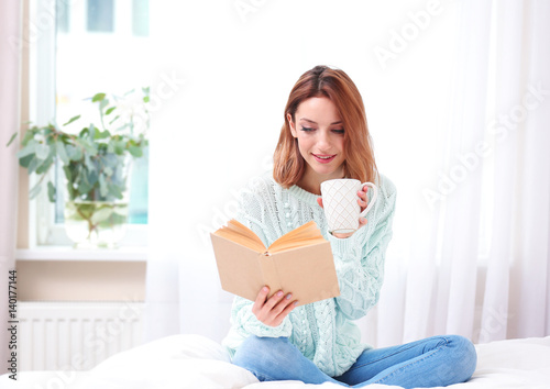 Young beautiful woman readi...