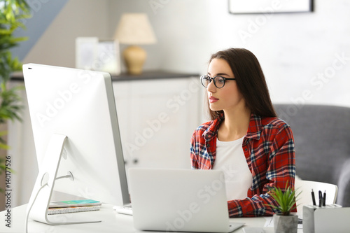 Young woman programmer work...