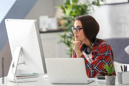 Young woman programmer work...